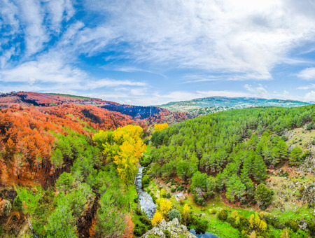 Beautiful autumn landscape with colorful forests and blue sky near Madrid in the autonomous community of Castilla y Leon, Spainの写真素材