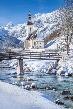 Panoramic view of scenic winter landscape in the Bavarian Alps with famous Parish Church of St. Sebastian in the village of Ramsau, Nationalpark Berchtesgadener Land, Upper Bavaria, Germanyの写真素材