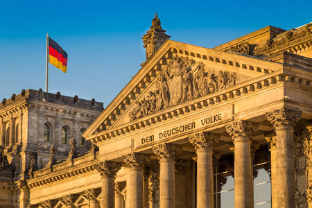 Close-up view of famous Reichstag building, seat of the German Parliament Deutscher Bundestag, in beautiful golden evening light at sunset, Berlin, Germanyの写真素材