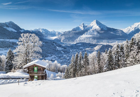 Beautiful mountain landscape in the Bavarian Alps with village of Berchtesgaden and Watzmann massif in the background at sunrise, Nationalpark Berchtesgadener Land, Bavaria, Germanyの写真素材