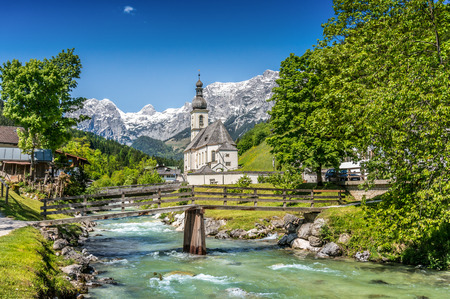 Scenic mountain landscape in the Bavarian Alps with famous Parish Church of St. Sebastian in the village of Ramsau, Nationalpark Berchtesgadener Land, Upper Bavaria, Germanyの写真素材