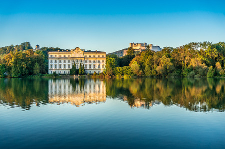 Famous Schloss Leopoldskron with Hohensalzburg Fortress in Salzburg at sunset, Austriaのeditorial素材