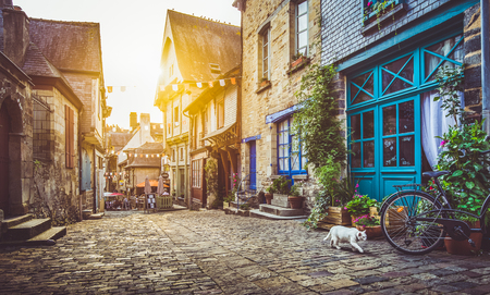 Old town in Europe at sunset with retro vintage style filter and lens flare effectの写真素材
