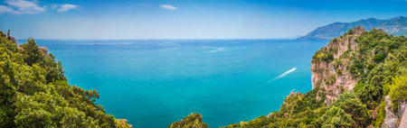 Scenic picture-postcard coast-to-coast panorama of famous Amalfi Coast with beautiful Gulf of...