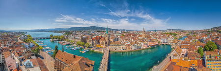 Aerial view of Zurich city center with famous Fraumunster and St. Peter Churches and river Limmat at Lake Zurich from Grossmunster Church on a sunny day with blue sky in summer, Canton Zurich, Switzerlandの写真素材