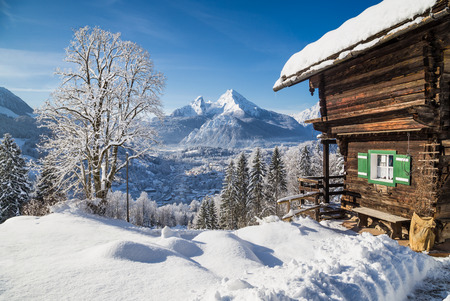 Beautiful mountain landscape in the Bavarian Alps with village of Berchtesgaden and Watzmann massif in the background at sunrise, Nationalpark Berchtesgadener Land, Bavaria, Germany