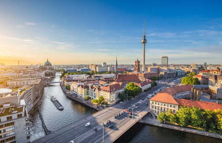 Aerial view of Berlin skyline with famous TV tower and Spree river in beautiful evening light at sunset, Germanyの写真素材