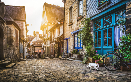 Old town in Europe at sunset with retro vintage style filter and lens flare effectの写真素材