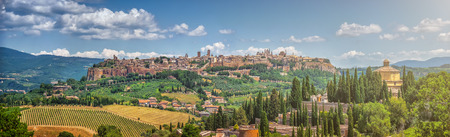 Beautiful panoramic view of the ancient etruscan town of Orvieto on a sunny day with blue sky in summer, Umbria, Italyの写真素材
