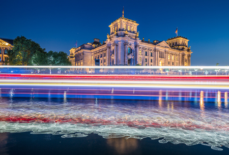 Panoramic view of Berlin government district with famous Reichstag building, seat of the German Parliament (Deutscher Bundestag), and Paul Lobe Haus in twilight during blue hour at dusk, Berlin, Germanyの写真素材