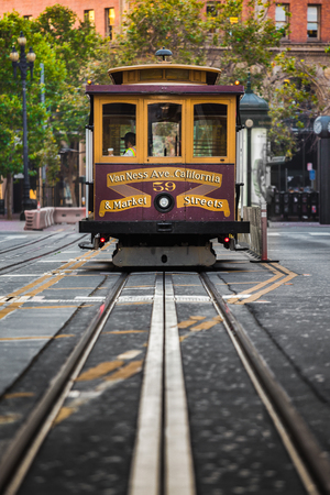 Classic view of historic Cable Car riding on famous California Street on a beautiful sunny day in summer, San Francisco, California, USAの写真素材