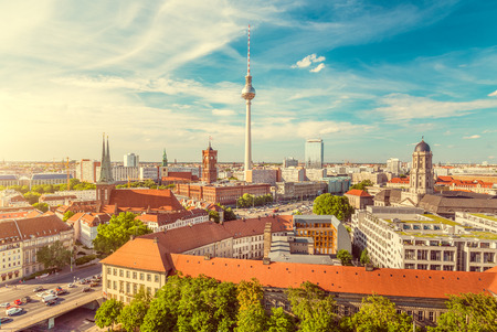 Aerial view of Berlin skyline with famous TV tower and Spree river on a beautiful day with blue sky and clouds with retro vintage filter effect, Germanyの写真素材