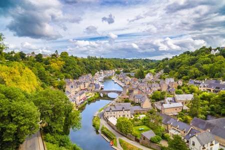 Aerial view of the historic town of Dinan with Rance river with dramatic cloudscape, Cotes-d'Armor department, Bretagne, northwestern Franceの写真素材