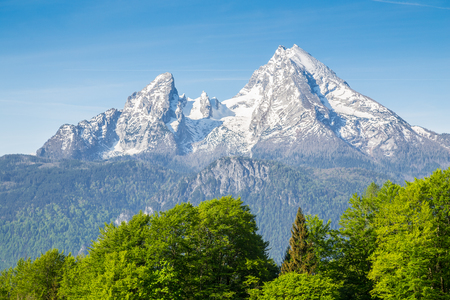 Closeup view of famous Watzmann mountain peak on a beautiful sunny day with blue sky and clouds in summer, Nationalpark Berchtesgadener Land, Bavaria, Germanyの写真素材