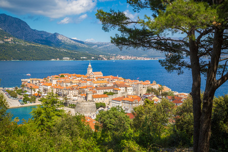 Beautiful view of the historic town of Korcula on a beautiful sunny day with blue sky and clouds in summer, Island of Korcula, Dalmatia, Croatiaの写真素材