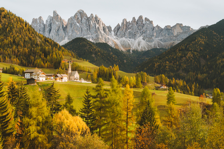 Beautiful view of idyllic mountain scenery in the Dolomites with famous Santa Maddelana mountain village in beautiful golden eveningの写真素材