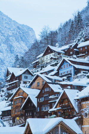 Classic postcard view of traditional wooden houses in famous Hallstatt lakeside townの写真素材