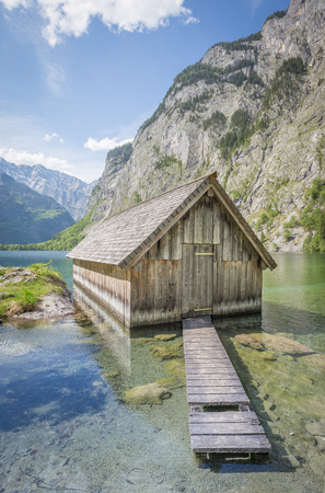 Beautiful view of traditional wooden boat house at the shores of famous Lake Oberseeの写真素材