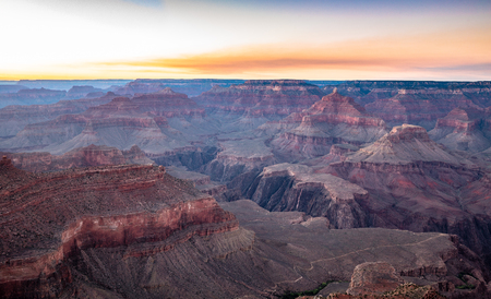 Scenic aerial view of famous Grand Canyon, often considered one of the Seven Natural Wonders of the World, in beautiful post sunset twilight at dusk in summer, Arizona, American Southwest, USAの写真素材