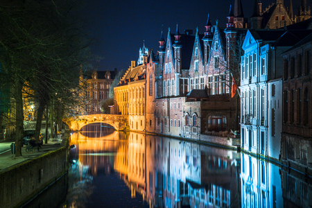 Classic panoramic twilight view of the historic city center of Brugge during beautiful evening blue hour at dusk, province of West Flanders, Belgiumの写真素材