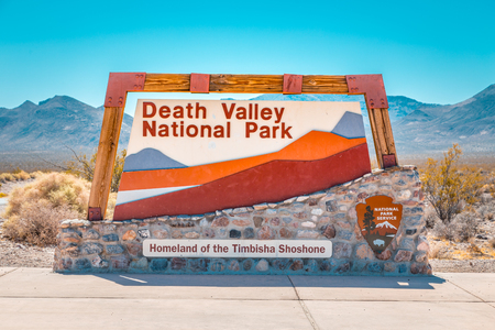 Classic view of famous Death Valley National Park entrance sign on a sunny day with blue sky in summer, California, USAの写真素材