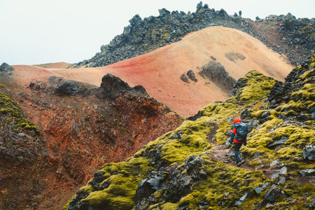 Beautiful view of idyllic mountain scenery with person hiking in Landmannalaugar in the highlands of Icelandの写真素材