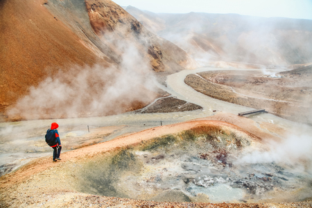 Beautiful view of idyllic geothermal mountain scenery with person hiking in Landmannalaugar in the highlands of Icelandの写真素材