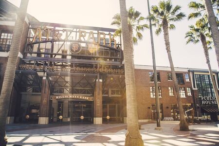 Panorama view of historic AT&T Park baseball park, home of the San Francisco Giants professional baseball franchise, on a beautiful sunny day with blue sky in summer, San Francisco, California, USAの写真素材
