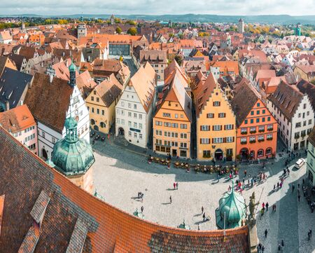 Aerial view of the medieval town of Rothenburg ob der Tauber on a beautiful sunny day with blue sky and clouds in summer, Bavaria, Germanyの写真素材