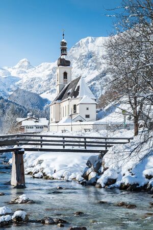 Scenic winter landscape in the Bavarian Alps with famous Parish Church of St. Sebastian in the village of Ramsau, Nationalpark Berchtesgadener Land, Upper Bavaria, Germanyの写真素材