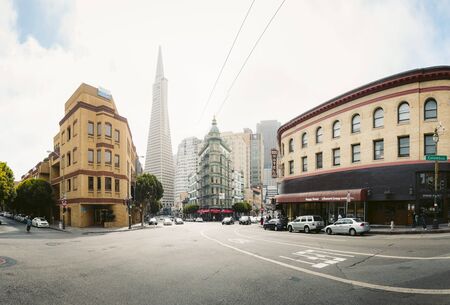Central San Francisco with famous Transamerica Pyramid and historic Sentinel Building at Columbus Avenue on a cloudy day, California, USAのeditorial素材
