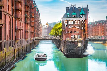 Hamburg Speicherstadt warehouse district with sightseeing boat, Hamburg, Germanyの写真素材
