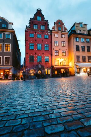 Classic view of colorful houses at famous Stortorget town square in Stockholm's historic Gamla Stan (Old Town) at night, central Stockholm, Swedenの写真素材