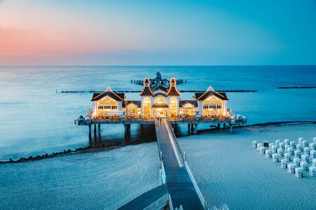 Famous Sellin Seebruecke (Sellin Pier) in beautiful evening twilight at dusk #in summer, Ostseebad Sellin tourist resort, Baltic Sea region, Germanyのeditorial素材