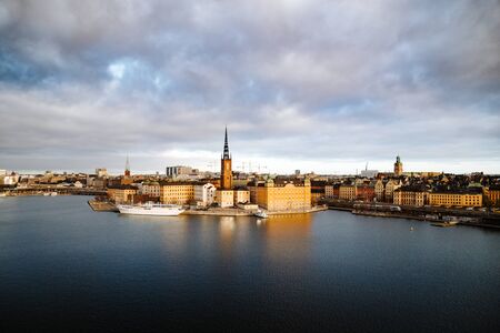 Classic view of Stockholm city center with famous Riddarholmen in Gamla Stan in beautiful golden morning light, Sodermalm, central Stockholm, Swedenの写真素材