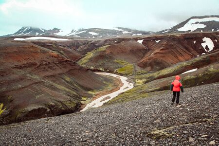 Beautiful view of idyllic mountain scenery with person hiking in Landmannalaugar in the highlands of Icelandの写真素材