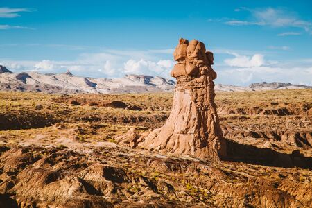 Panoramic view of beautiful desert landscape with hoodoos sandstone formations in Goblin Valley State Park in summer, Utah, USAの写真素材