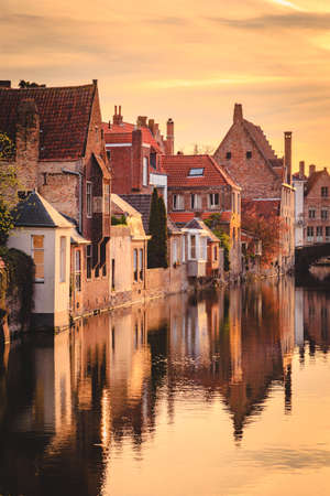 Scenic view of the historic city center of Brugge in beautiful golden morning light at sunrise, province of West Flanders, Belgiumのeditorial素材