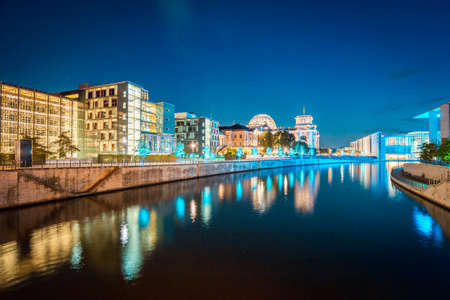 Panoramic twilight view of famous Berlin government district with Spree river during blue hour at dusk, central Berlin Mitte, Germanyのeditorial素材