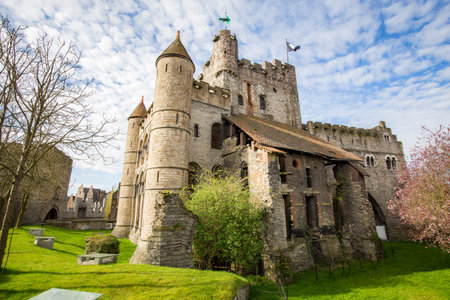 Beautiful view of famous medieval Gravensteen Castle on a beautiful sunny day with blue sky and...
