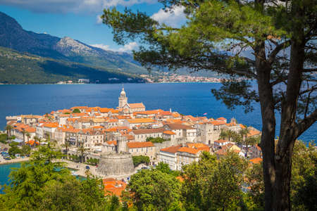 Beautiful view of the historic town of Korcula on a beautiful sunny day with blue sky and clouds in summer, Island of Korcula, Dalmatia, Croatiaの写真素材