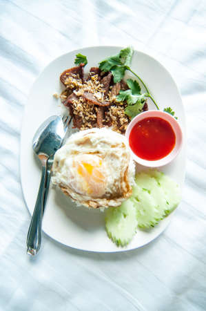 Rice topped with stir-fried pork and basil and Fried Egg ,thailand foodの写真素材