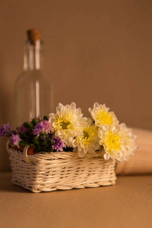 Colorful flowers in the wooden bucketの写真素材