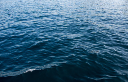 Image of ripple waves beside boat