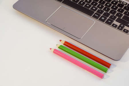 laptop lying on the desk and next to it samples, fabrics, veneers, wood, stoneの写真素材