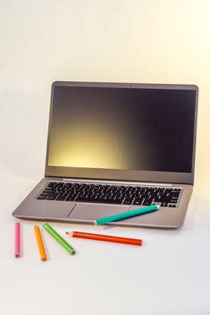 laptop lying on the desk and next to it samples, fabrics, veneers, wood, stoneの写真素材
