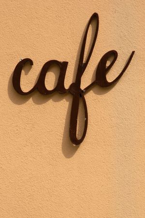 Cafe sign on beige wallの写真素材