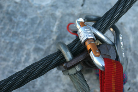 Climbing carabiner on a steel rope - via ferrata