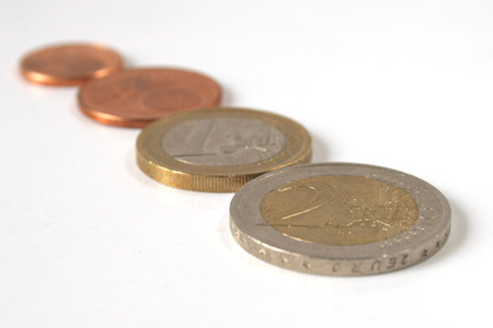Euro coins in diagonal line isolated over white background