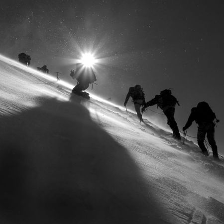 Climbers climbing the glacierの写真素材